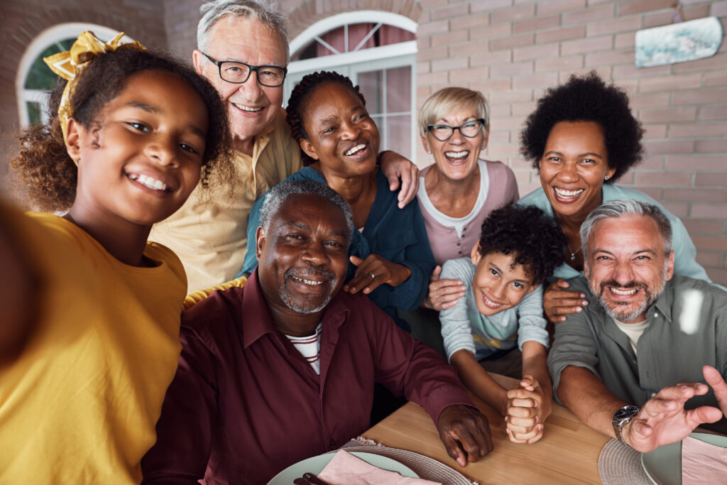 A group photo of a cheerful multiethnic family