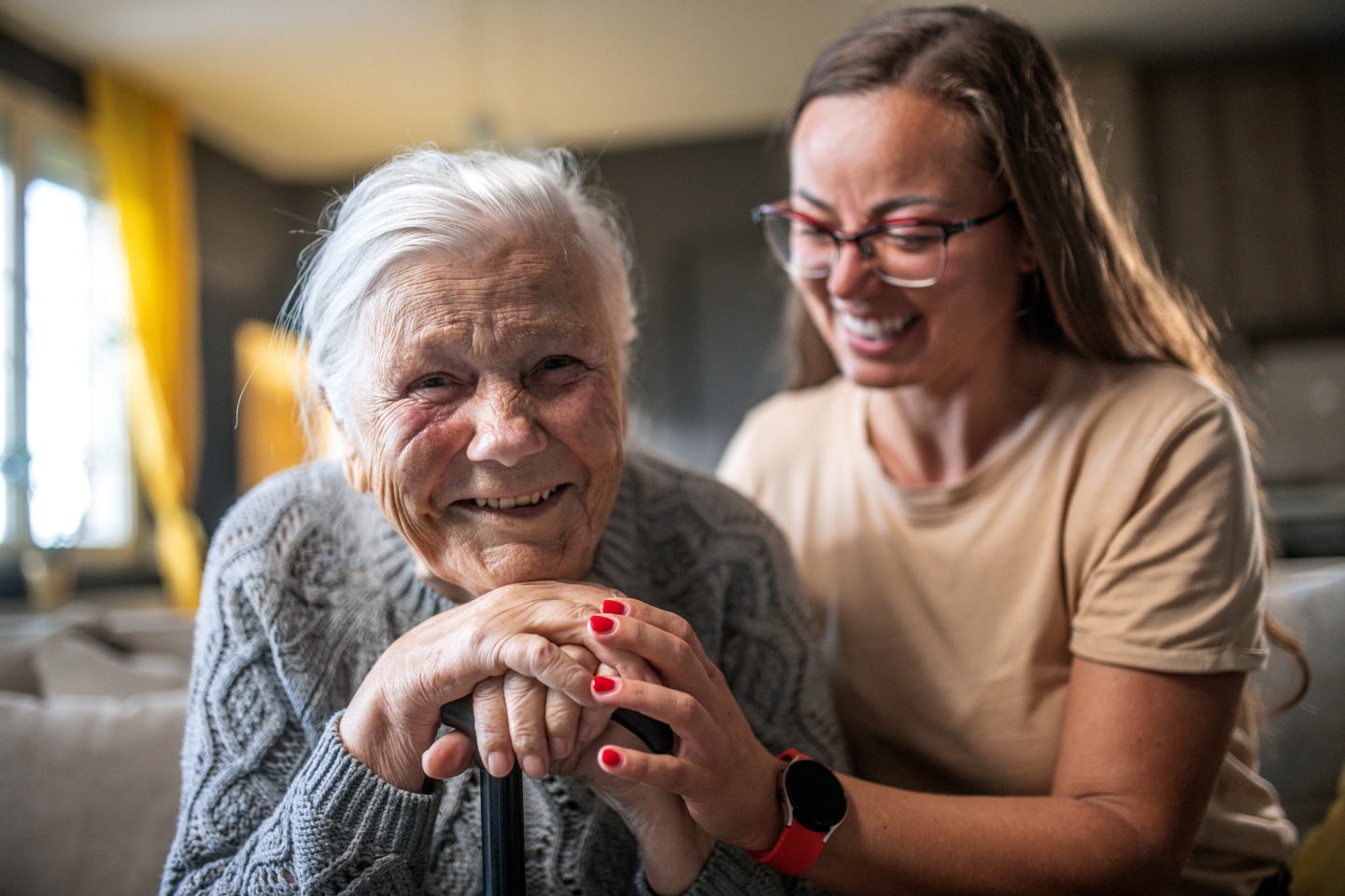 A smiling grandmother with her granddaughter