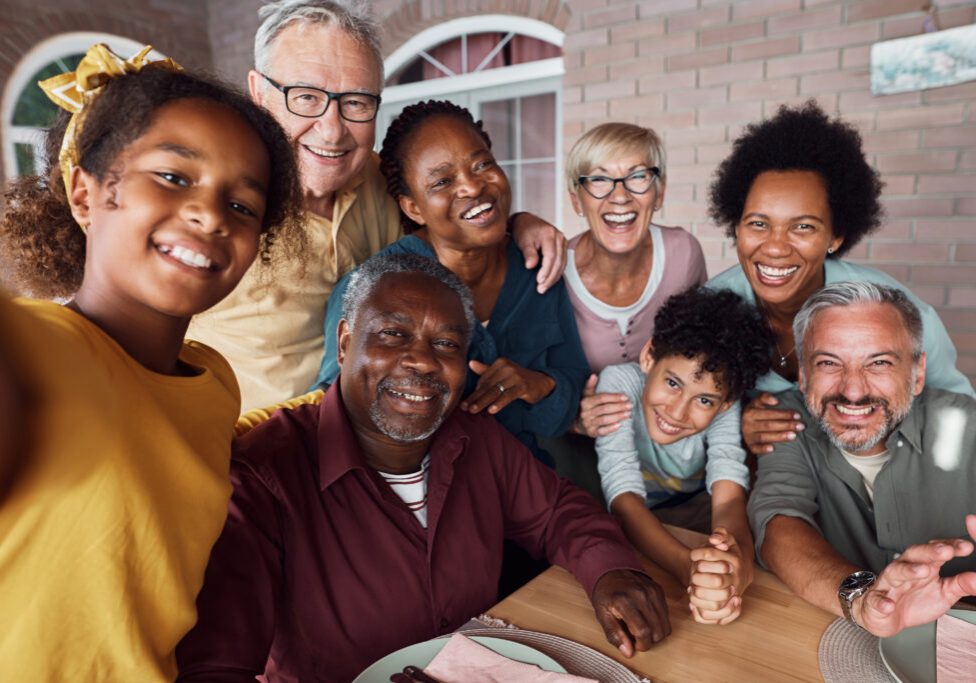 A group photo of a cheerful multiethnic family